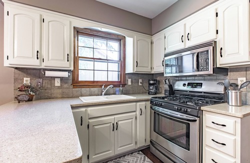 Overland Park House | Suburban Farmhouse w/Match Soccer Vibes