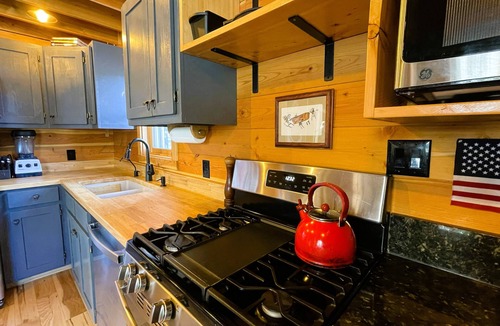 Cameron Cabin | Swiftcurrent Cabin-Cozy Cabin with a Hot Tub on the River next to the Wilderness