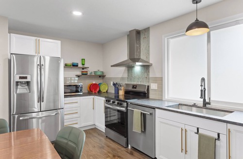Sunset Hills House | The Lime & Leaf: Pet Friendly 2-bedroom house with AC in Lawrence, near KU