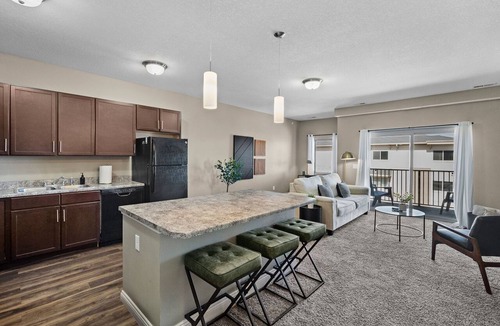West Des Moines Apartment | Top Floor, Modern Suite with Balcony Pool Views