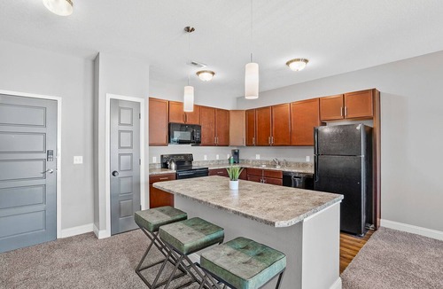 West Des Moines Apartment | Top Floor, Modern Suite with Balcony Pool Views