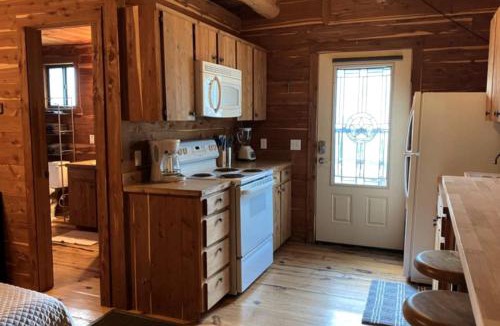 Prairie Lea House | Tranquil Log Cabin by the San Marcos River - A Relaxing Glamping Getaway near Kingsbury, Texas