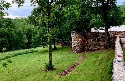 Omaha Cottage | Tranquil Stone Cottage Behind Castle Walls in the Ozarks
