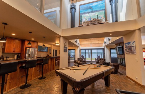 Sunnyland House | Unique riverfront home w/beach, dock, watersports, firepit, hot tub, and sauna!