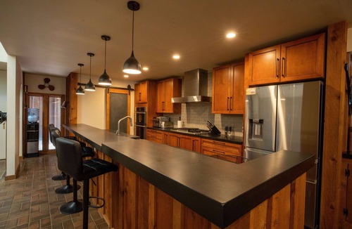Sunnyland House | Unique riverfront home w/beach, dock, watersports, firepit, hot tub, and sauna!