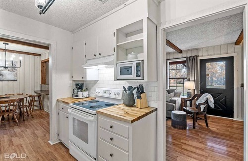 Uncertain Cabin | Unwind in a cozy rustic-modern cabin with a front porch, private dock access, firepit nights, outdoor dining, and cornhole. RV site next to house.