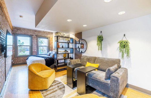 Rogers Apartment | Urban Brick Loft Studio Ride to Trails Walk to Dining, Shops & Nightlife