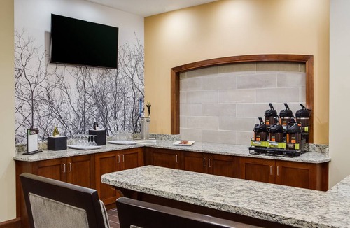 Historic East Village Condo | Warm and Welcoming Suite | Free Breakfast, Indoor Pool + Hot Tub