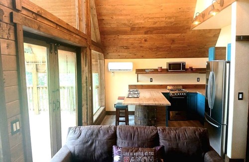 Plantersville Cabin | Waterfront Cabin Retreat with Private Dock and Pool in Plantersville Texas