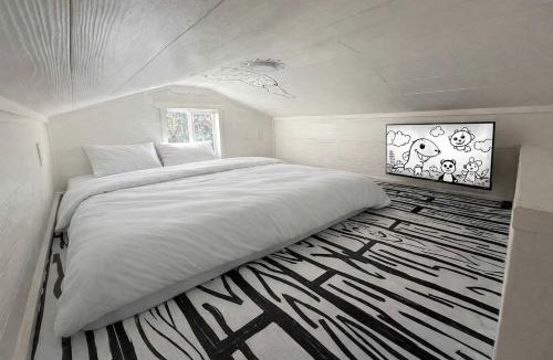 Paige House | Whimsical Lakefront Tiny Home with Hand-Drawn Doodle Design Near Bastrop, Texas