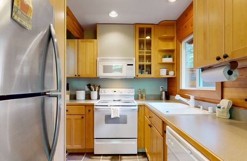 Sudden Valley House | Wilderness retreat on a double lot with a fireplace, large deck, & W/D