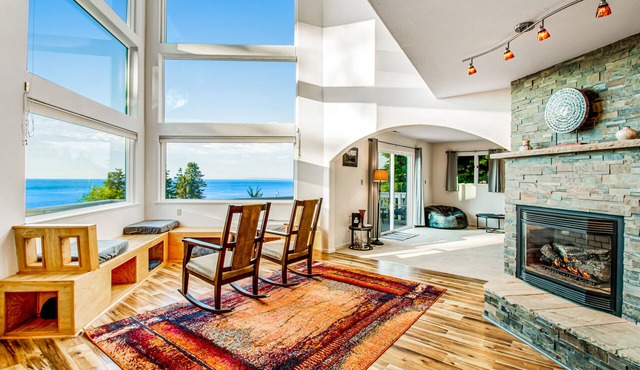 2-story inviting home with water & mountain views, deck, & gas fireplace