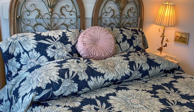 A shady retreat within a flower garden, with a boutique hotel feel. Close in