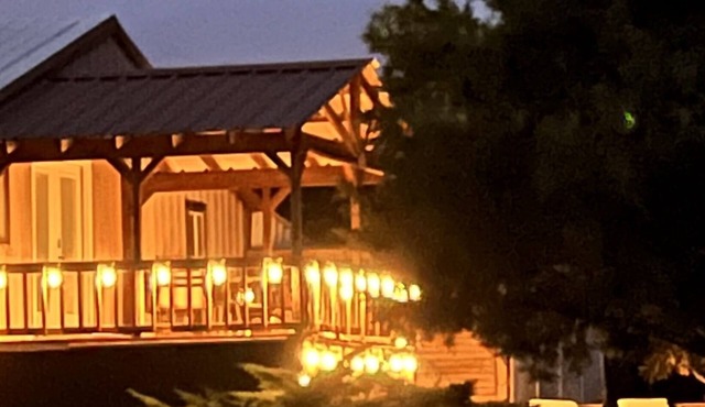 Enjoy our loft with a private hot tub overlooking the vineyard and pond.