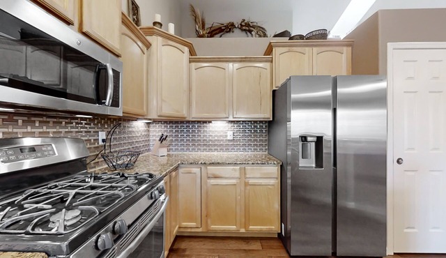 Lovely home with an enclosed yard, fireplace, pool table, games, W/D, & AC