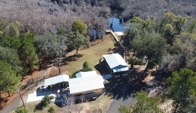 New listing! Waterfront with dock, boat ramp! Surrounded by tupelo & cypress!