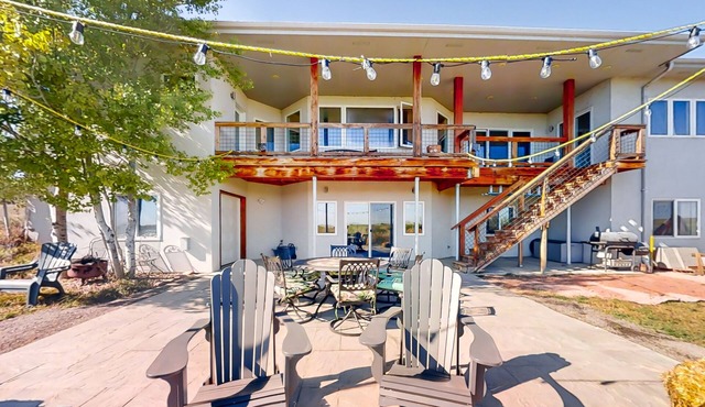 Newly built walkout basement with water views, patio, & Ping-Pong table