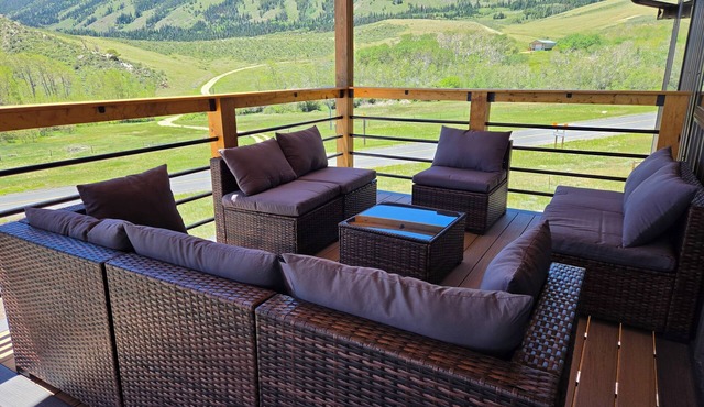 Pine & Peak Lodge in Centennial, WY Patio Seating & Game Area -No cleaning fee-