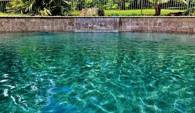 POOL with waterfall.Fenced yard! Fire pit, Hot tub, big deck and big fish!