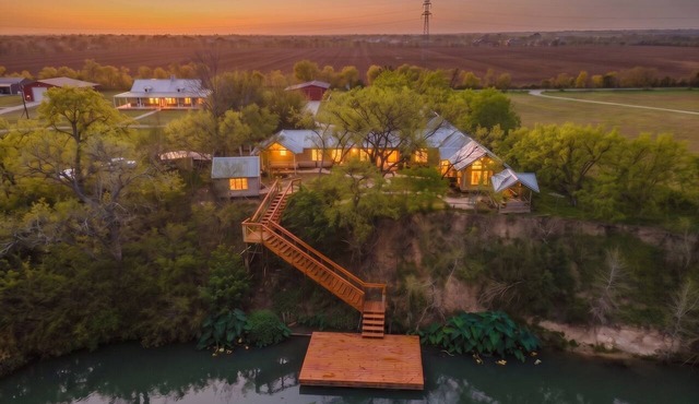 Private Riverfront Estate with Dock, Pool, Hot Tub, and Gym