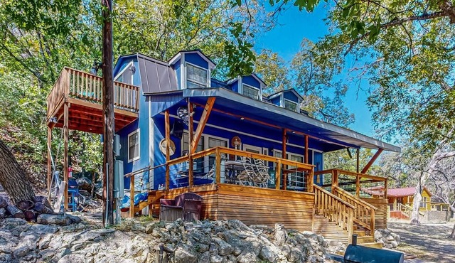 Riverside Retreat with outside dining area, deck and internet