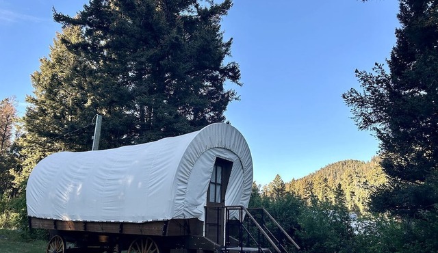 Rustic Conestoga Wagon Stay with Lodge Amenities near Boulder Creek, Montana