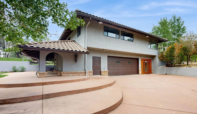 Spacious home with indoor heated pool, volley ball court, and is dog-friendly