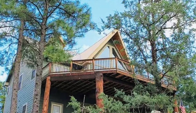 This is a luxurious two-story mountain retreat tucked in Ruidoso Downs, NM.