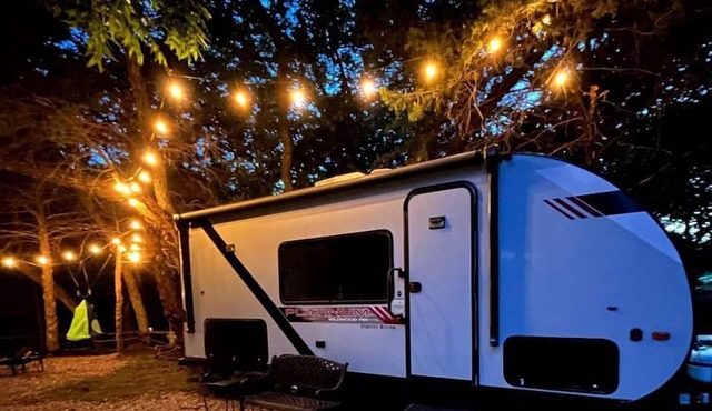 Unique Jungle-Style Glamping RV with 8-Foot Suspended Tree Tent near Creek Trails in Forestburg, Texas